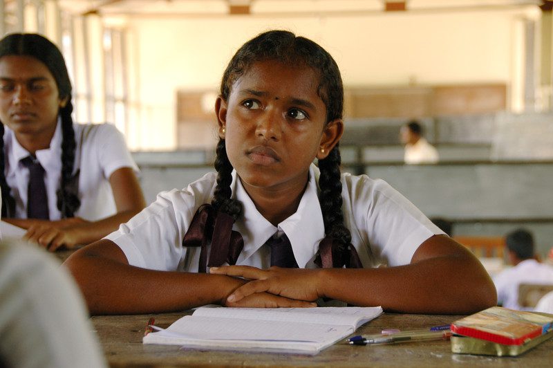 Dimulagala, Sri Lanka. Jayanthini listens to the teacher during her year 11 maths class.