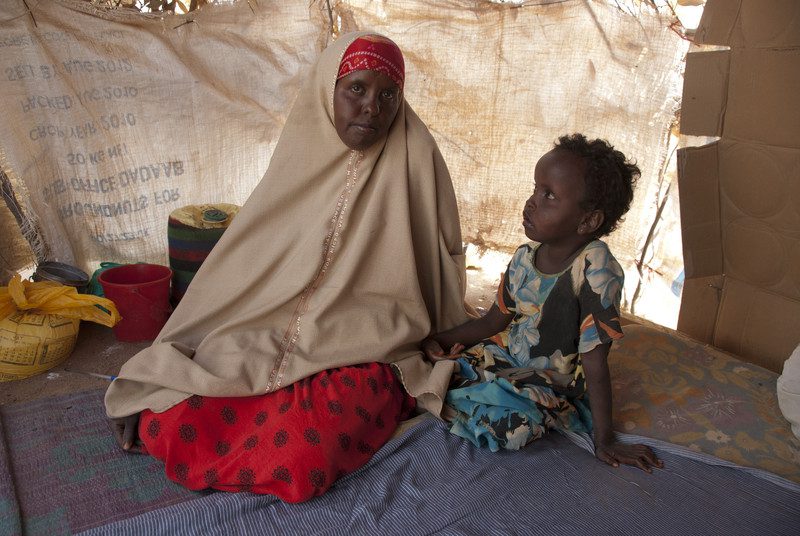 Deka Abdullahi, aged 24 pictured with her child, Rahma Mohammed, aged five in IFO extension camp, Dadaab. Photo: Chee Chee Leung/OxfamAUS