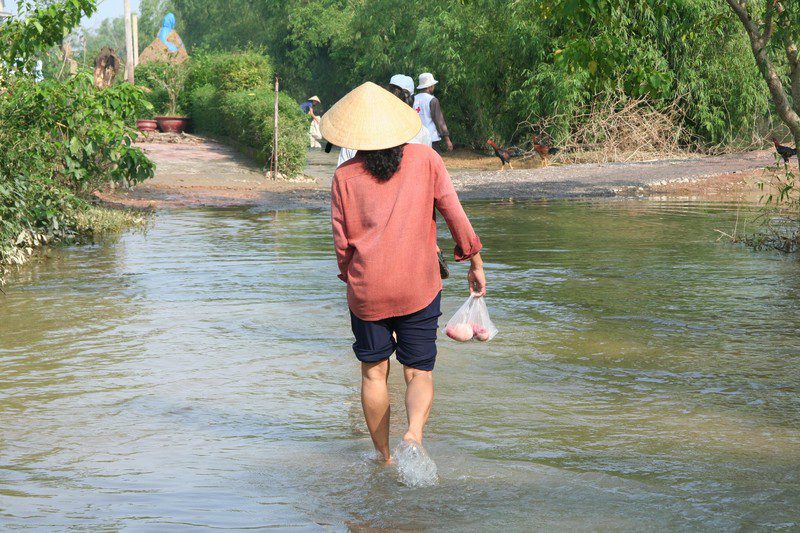 Walking through floods, Hai Lang district, Quang Tri province, central Vietnam.