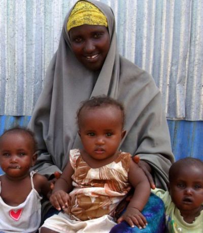 Ambiyo with her triplets. Photo: OxfamAUS