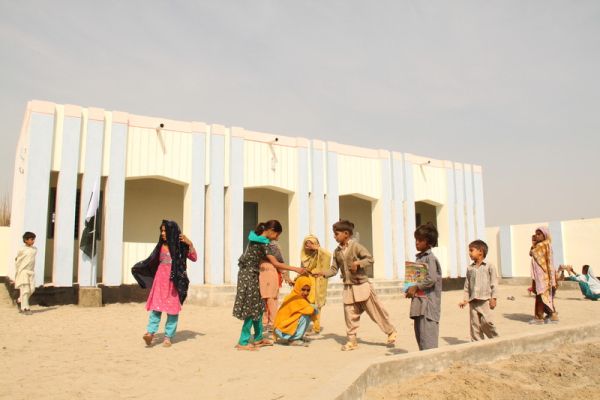 Kids playing outside their new school. Photo: Raheel Waqar/Oxfam