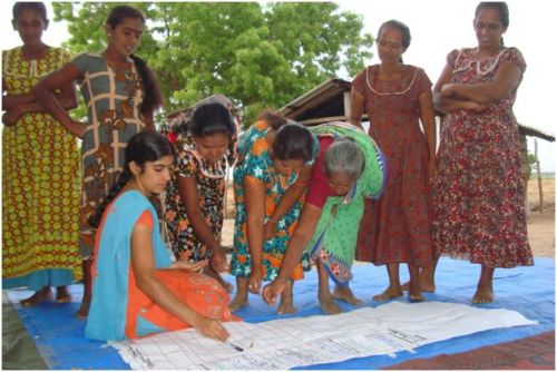 Sri Lankan women debate how to mitigate against the natural hazards in their village. Photo: Irshad Ahamed/OxfamAUS