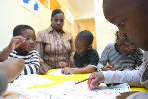 Kids absorbed in their colouring-in class at a home-based childcare centre, Durban. Photo: Gcina Ndwalane/OxfamAUS