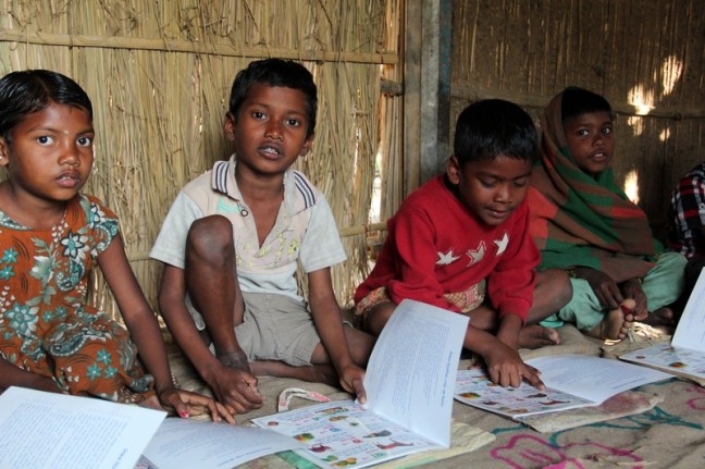 Students doing their lessons in Mominpur Preschool — one of 200 centres Oxfam supports in Bangladesh. Photo: Tania Cass