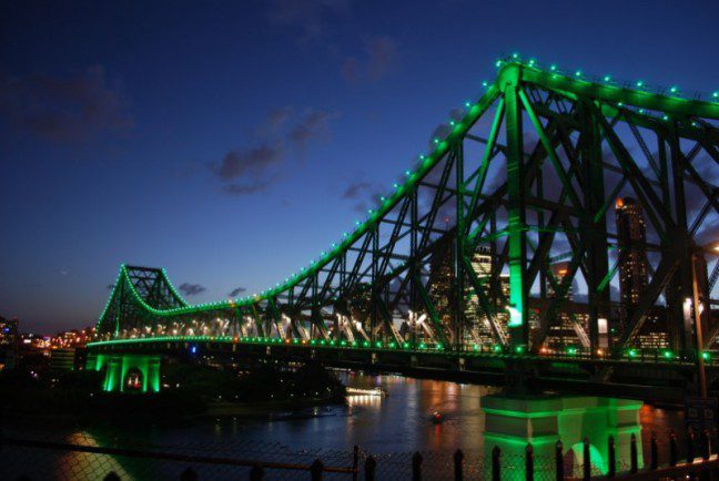 Brisbane’s iconic Story Bridge is now “Oxfam green”. Picture: Simon Barwick/Oxfam AU Brisbane’s iconic Story Bridge