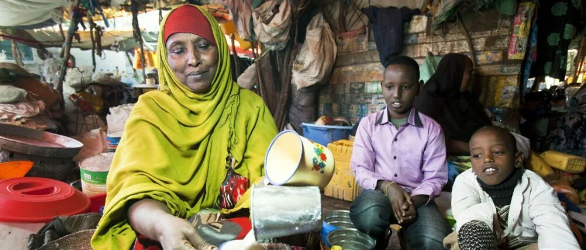 Photo: Petterik Wiggers A young boy waits for a fresh cup of Somali yoghurt made from cow’s milk at the market in Hargeisa, Somaliland. Milk is one of the staple foods in Somalia.