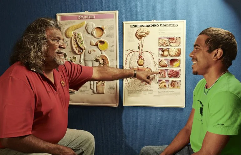 Geraldton Aboriginal Health worker, Eric Dalgety. Photo: Jason Malouin/Oxfam AUS Here, Geraldton Aboriginal Health worker, Eric Dalgety, speaks with a young client, Kane. Photo: Jason Malouin/Oxfam AUS.