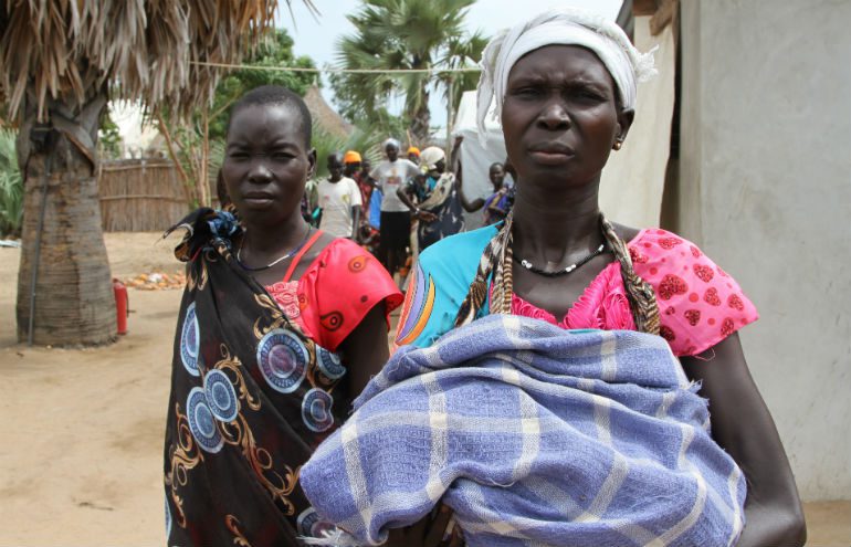 Fighting forced Mary (right) and her husband to flee the town of Mayendit in the north with their seven children while she was nine months pregnant. Photo: Dylan Quinnell / OxfamAUS