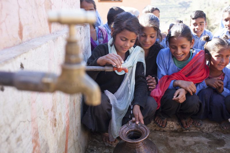 Baitadi, Nepal: Students pose for pictures with their recently installed tap stand