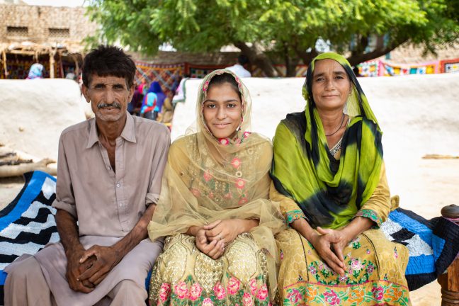 Photo: Pakistan – Samreen Babukha, 17, pictured with her mother and father. Credit: Khaula Jamil/OxfamAUS