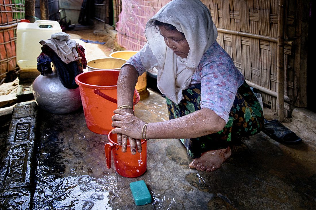 A woman washing her hands