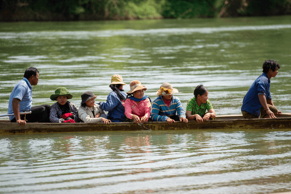 People from the Brao Indigenous group travel by boat to join a traditional ritual ceremony Mekong River