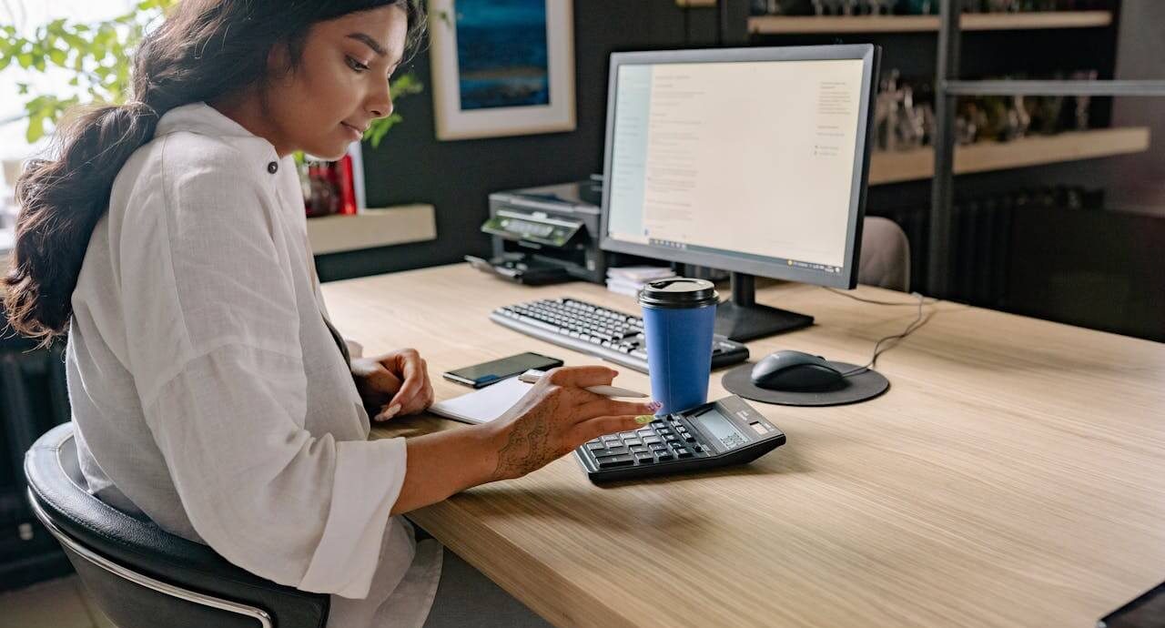 pexels-yankrukov-8837371 (1) A person using a calculator while doing their taxes. Photo: Yan Krukau/Pexels